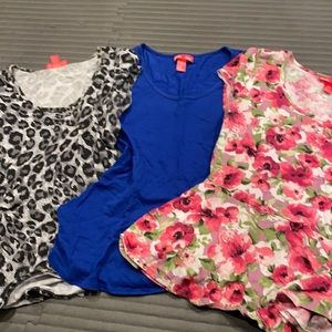 A bundle of three T-shirts with ruffled bottoms